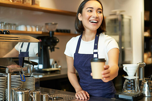 Woman serving coffee
