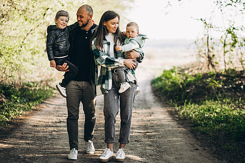 Family A family walks through a forest