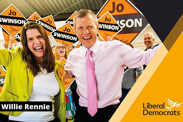 Jo Swinson and Willie Rennie on a Lib Dem membership card with words Willie Rennie