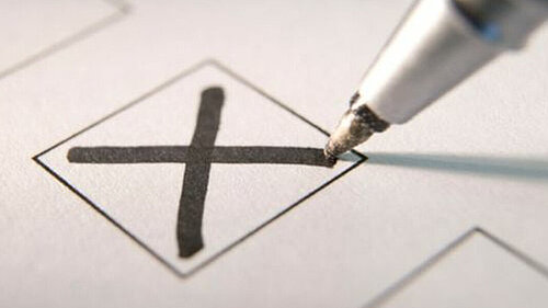 Vote A pen marking an X vote in a box