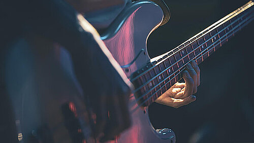 Someone playing a guitar