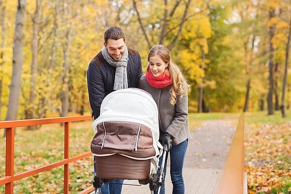 Parents Two people looking into a pram