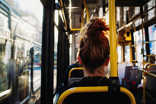 person sat on bus facing away from camera