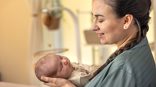 young mother with newborn baby