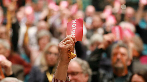 Delegates voting at Lib Dem Conference