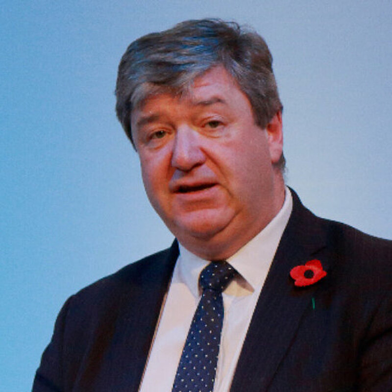 Alistair Carmichael speaks at a podium