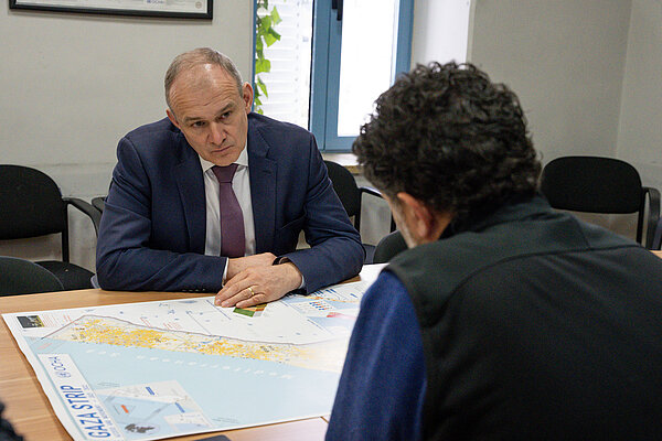 Ed Davey visits the UNOCHA Ed Davey is shown a map of Gaza in the offices of the UNOCHA